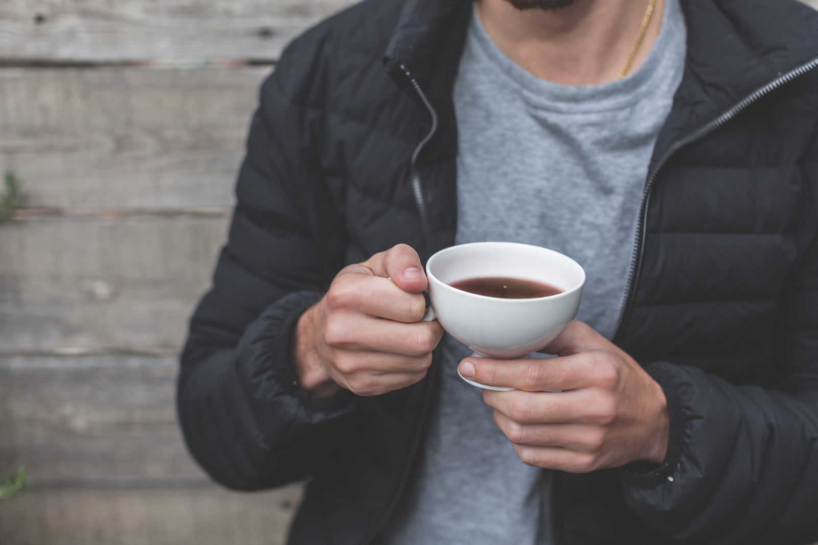 man_holding_a_cup_of_tea